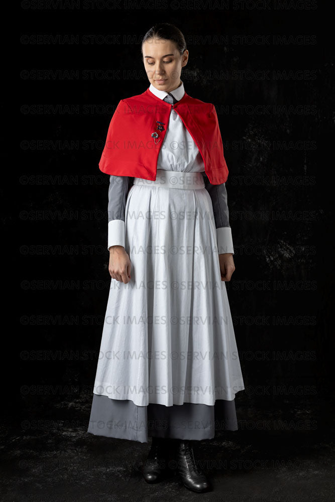 World War 1 nurse in grey uniform dress with a white apron and red cape (Sarah590)