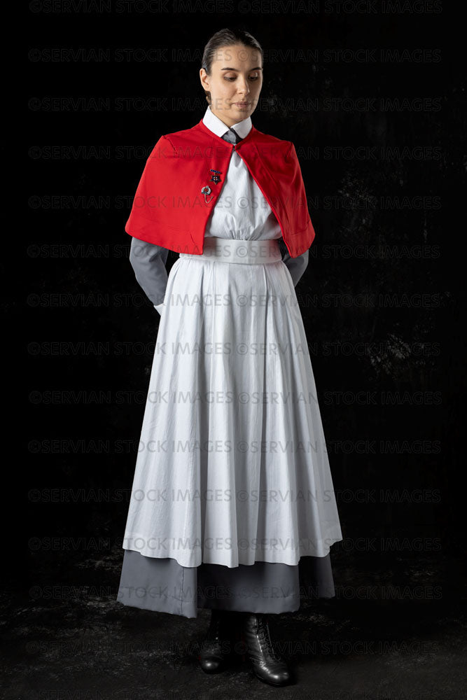 World War 1 nurse in grey uniform dress with a white apron and red cape (Sarah592)