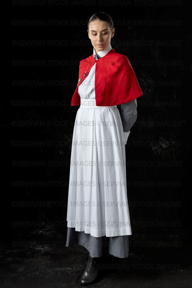 World War 1 nurse in grey uniform dress with a white apron and red cape (Sarah593)