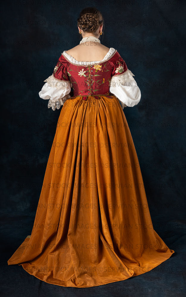 Renaissance or high fantasy woman wearing a red embroidered bodice  (Sarah 705)