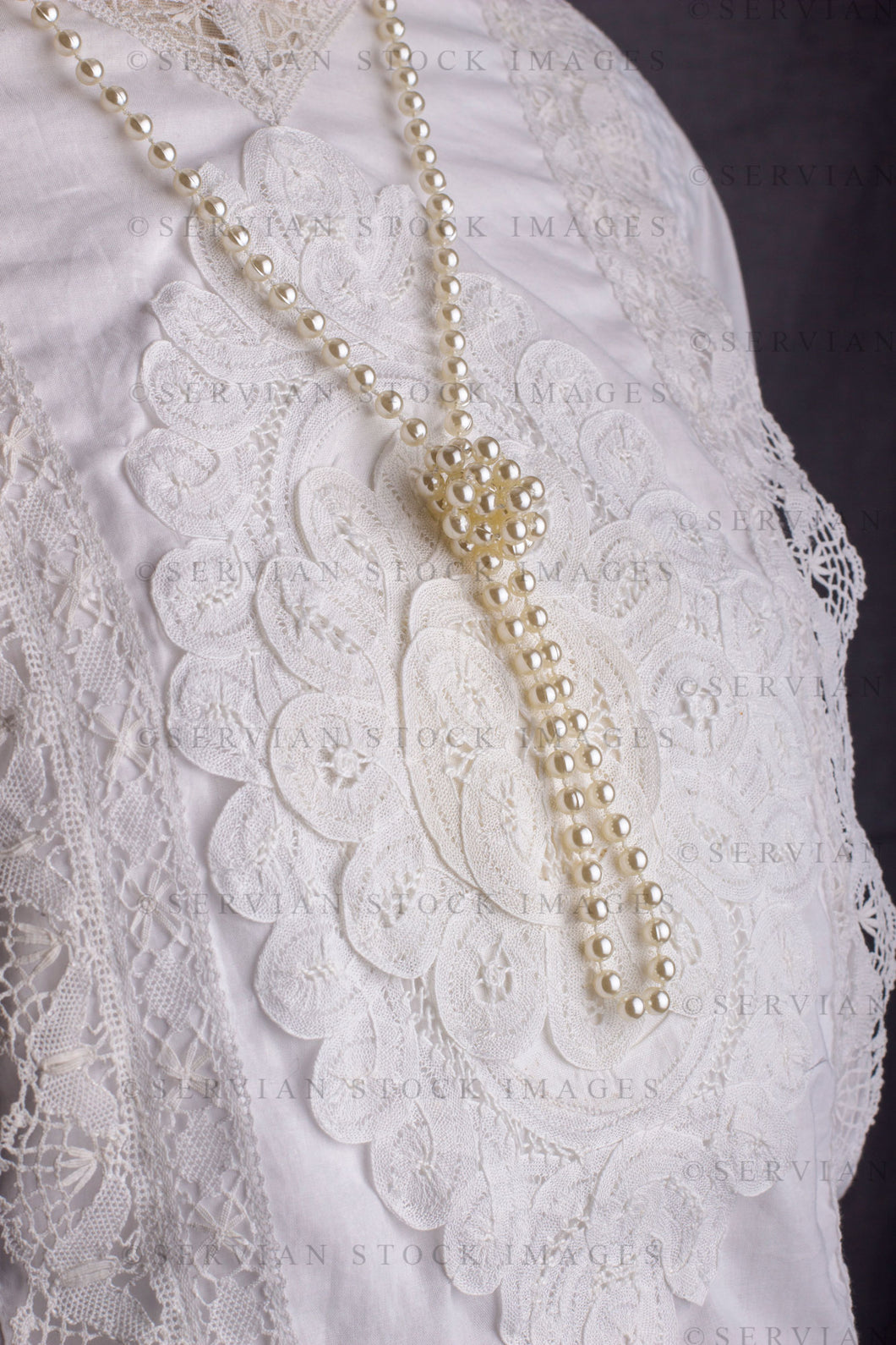 Edwardian woman in a white lace blouse and skirt with a pearl necklace (Tayla 0022)