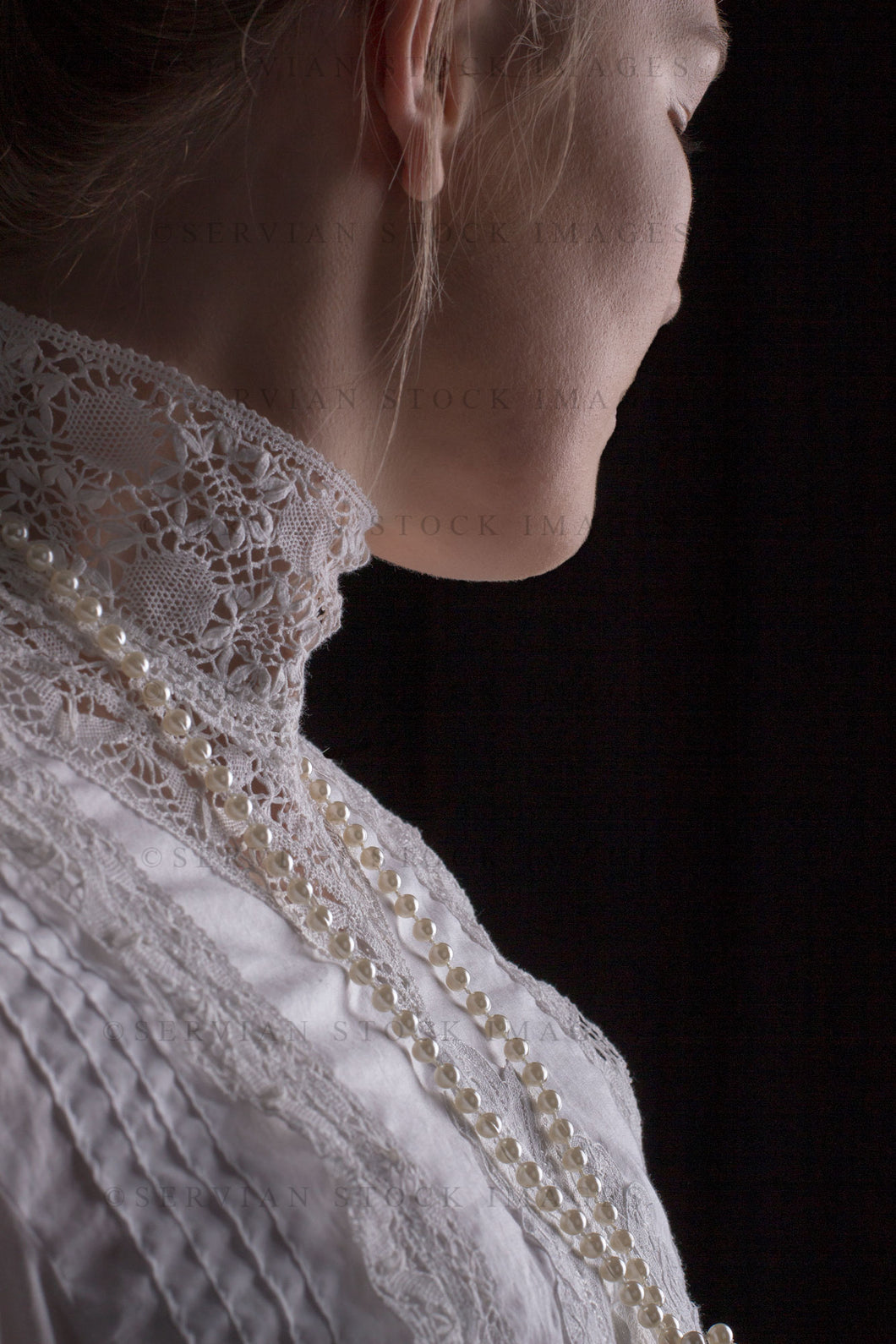 Edwardian woman in a white lace blouse and skirt with a pearl necklace (Tayla 0023)
