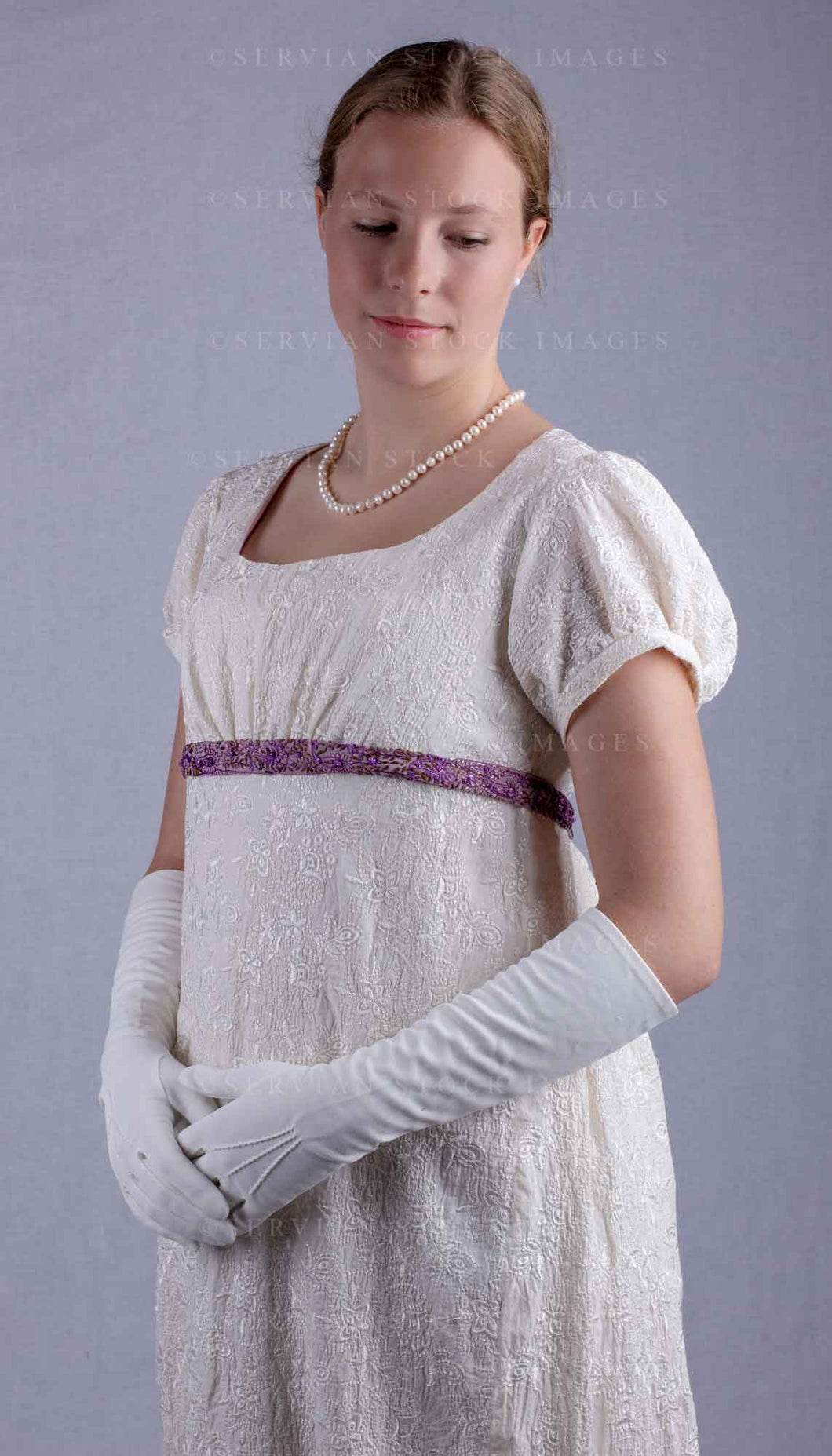 Regency woman in a cream embroidered dress and long gloves (Skye 0025)