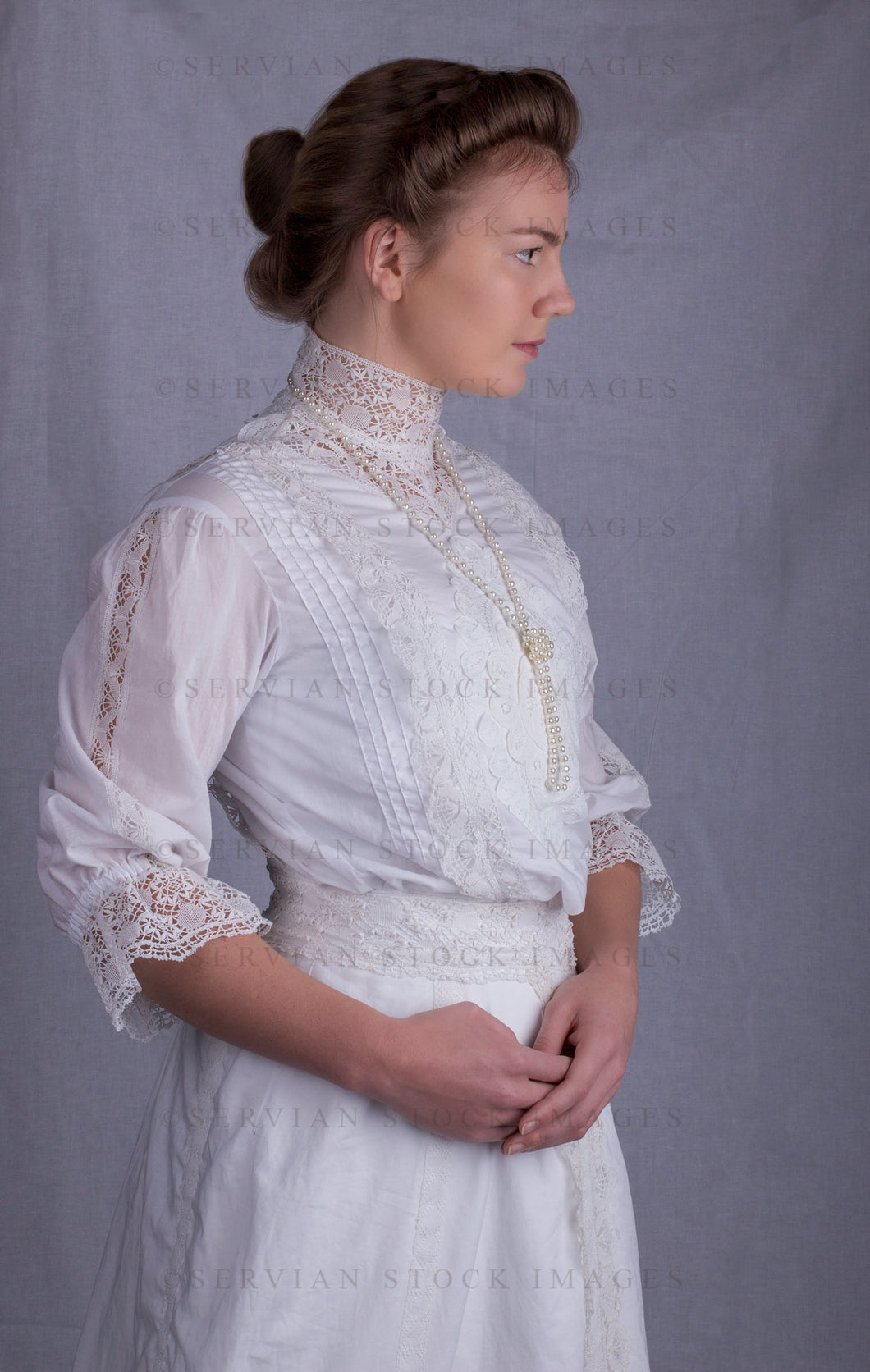Edwardian woman in a white lace blouse and skirt with a pearl necklace (Tayla 0034)