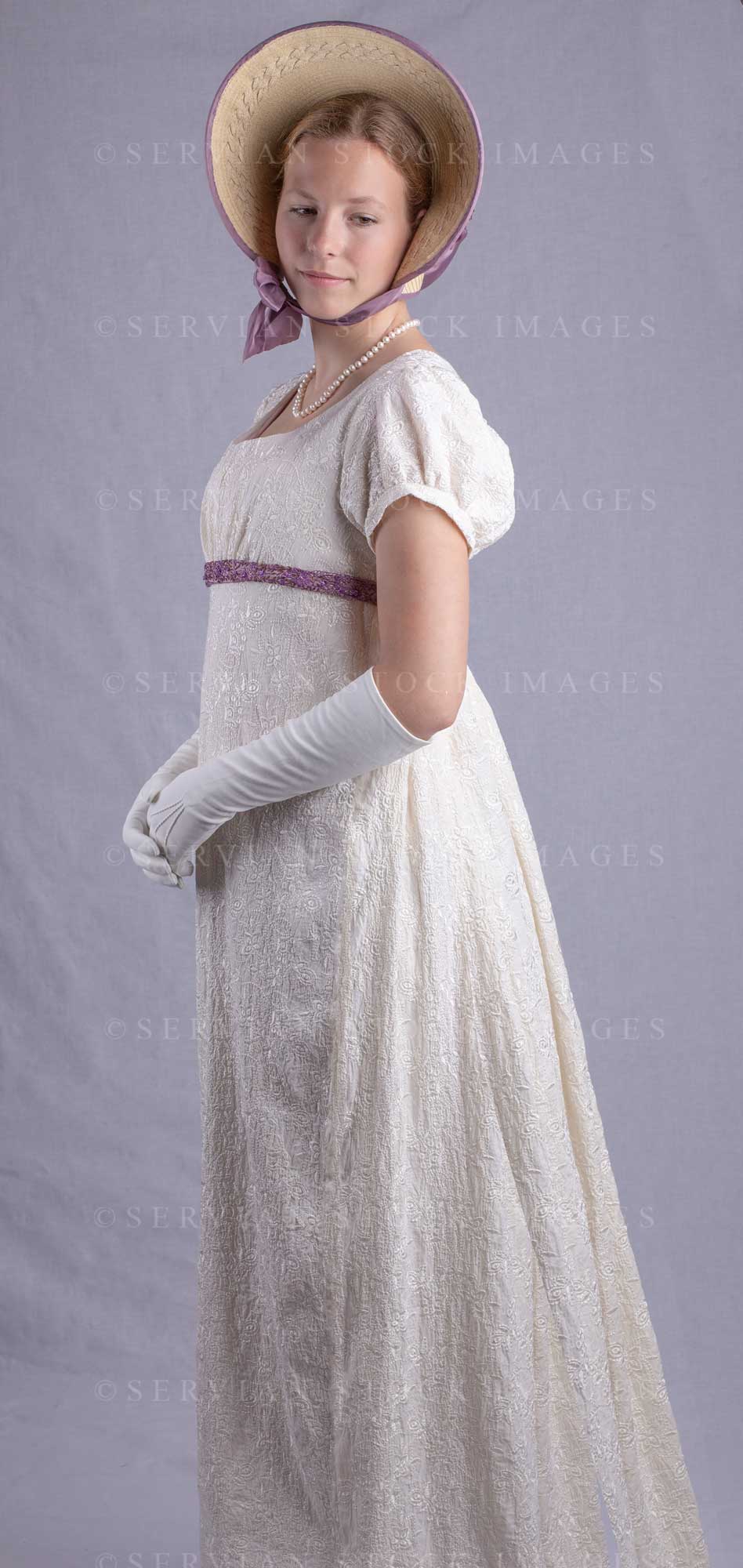 Regency woman in a cream embroidered dress and long gloves (Skye 0034)