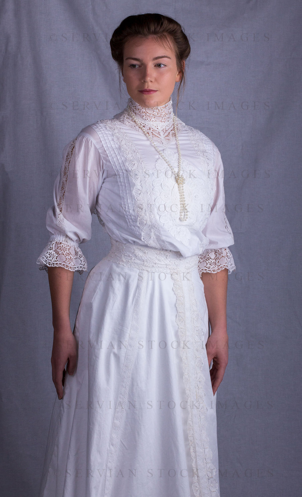 Edwardian woman in a white lace blouse and skirt with a pearl necklace (Tayla 0039)