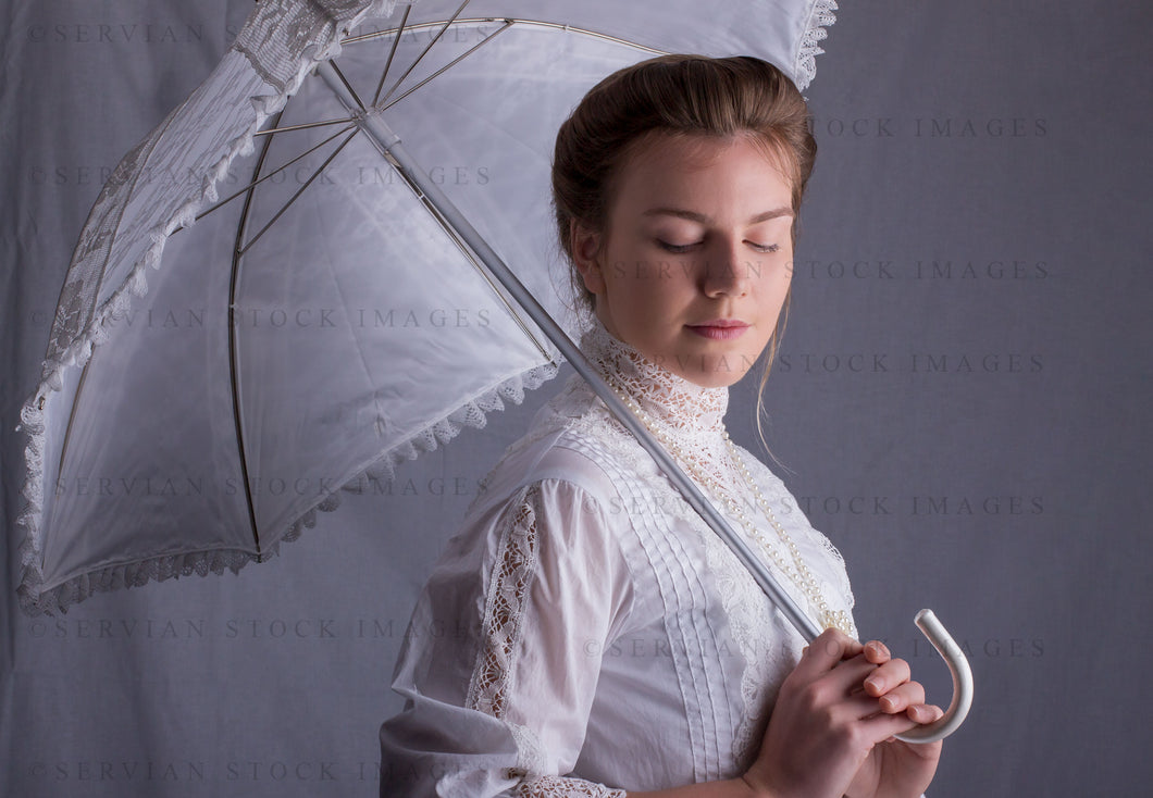 Edwardian woman in a white lace blouse and skirt with a pearl necklace (Tayla 0049)