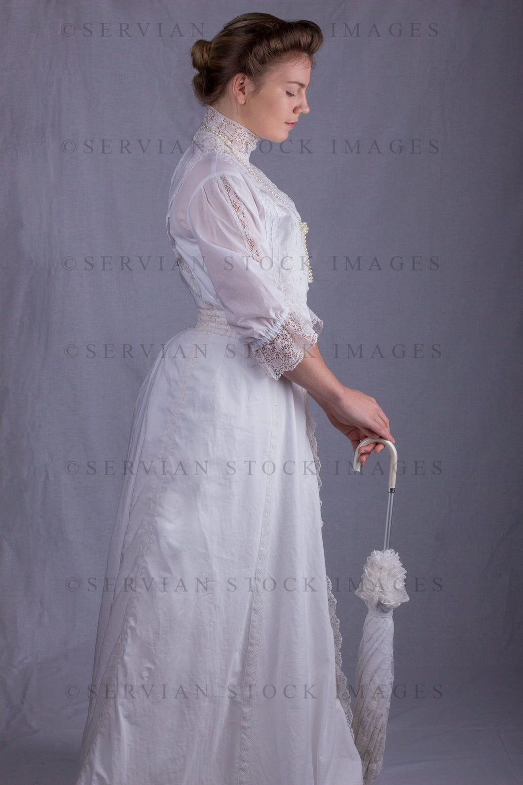 Edwardian woman in a white lace blouse and skirt with a pearl necklace (Tayla 0064)
