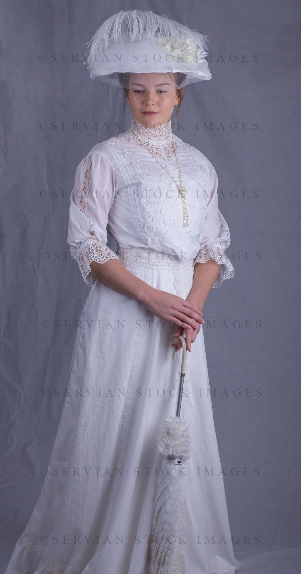 Edwardian woman in a white lace blouse and skirt with a pearl necklace (Tayla 0075)