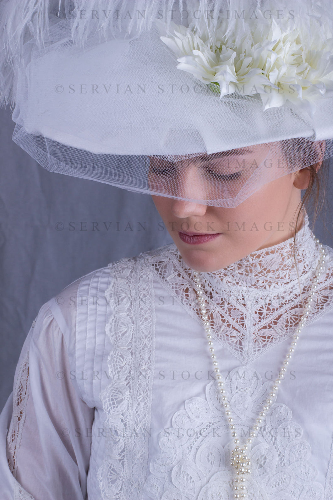 Edwardian woman in a white lace blouse and skirt with a pearl necklace (Tayla 0080)