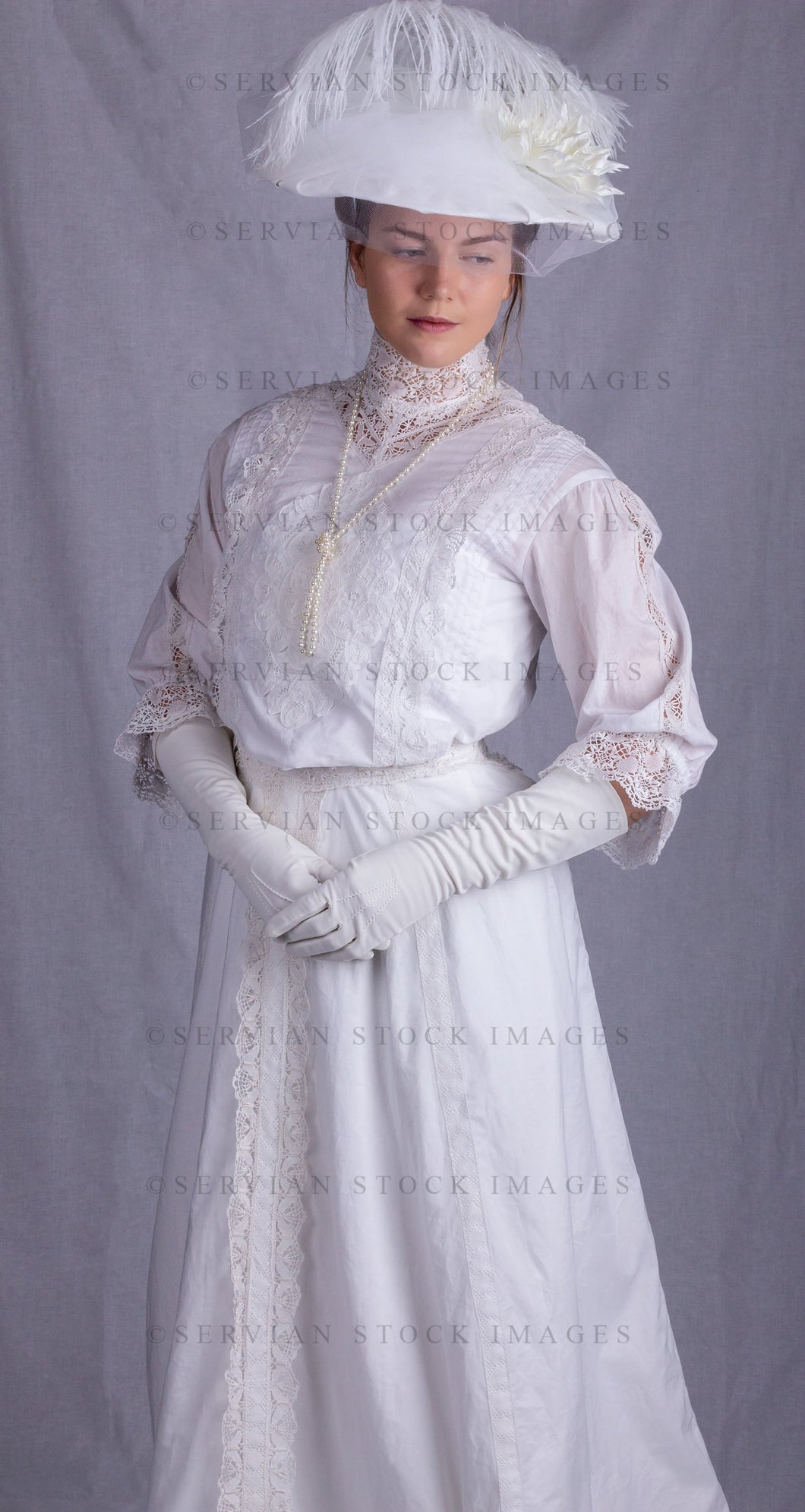 Edwardian woman in a white lace blouse and skirt with a pearl necklace (Tayla 0088)