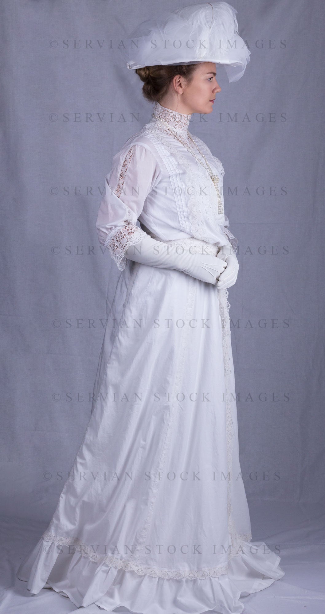 Edwardian woman in a white lace blouse and skirt with a pearl necklace (Tayla 0094)