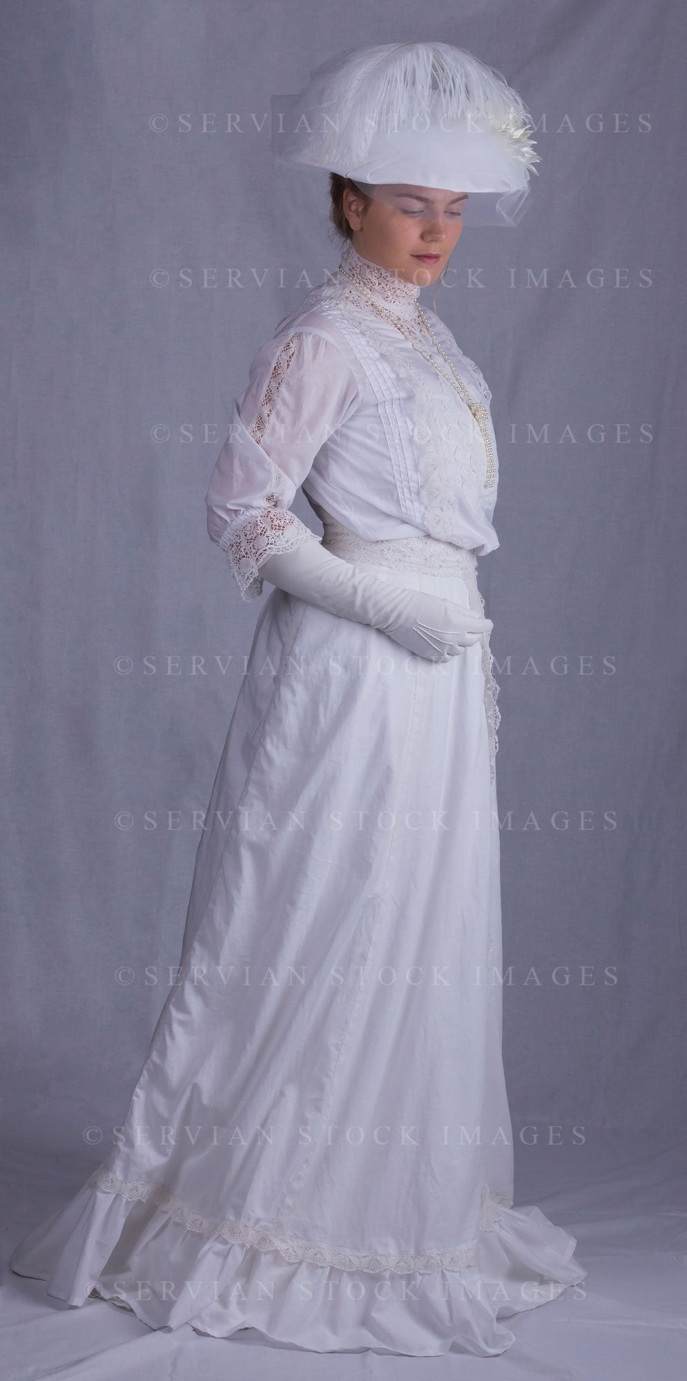 Edwardian woman in a white lace blouse and skirt with a pearl necklace (Tayla 0098)