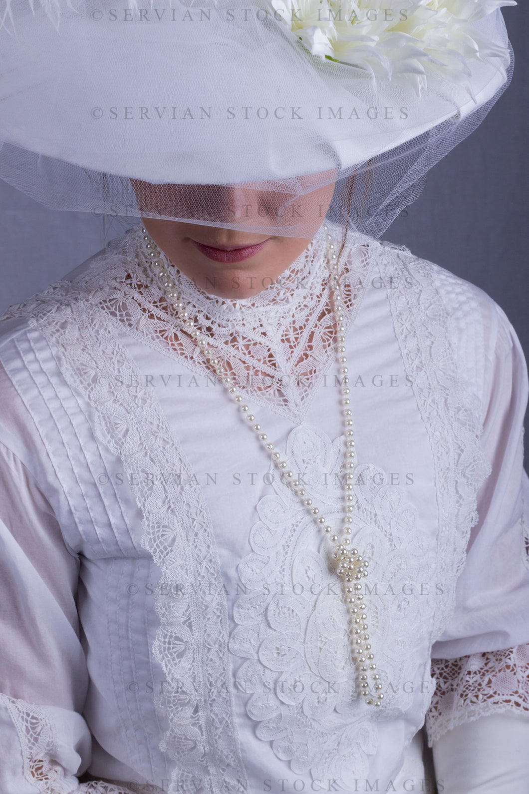Edwardian woman in a white lace blouse and skirt with a pearl necklace (Tayla 0101)