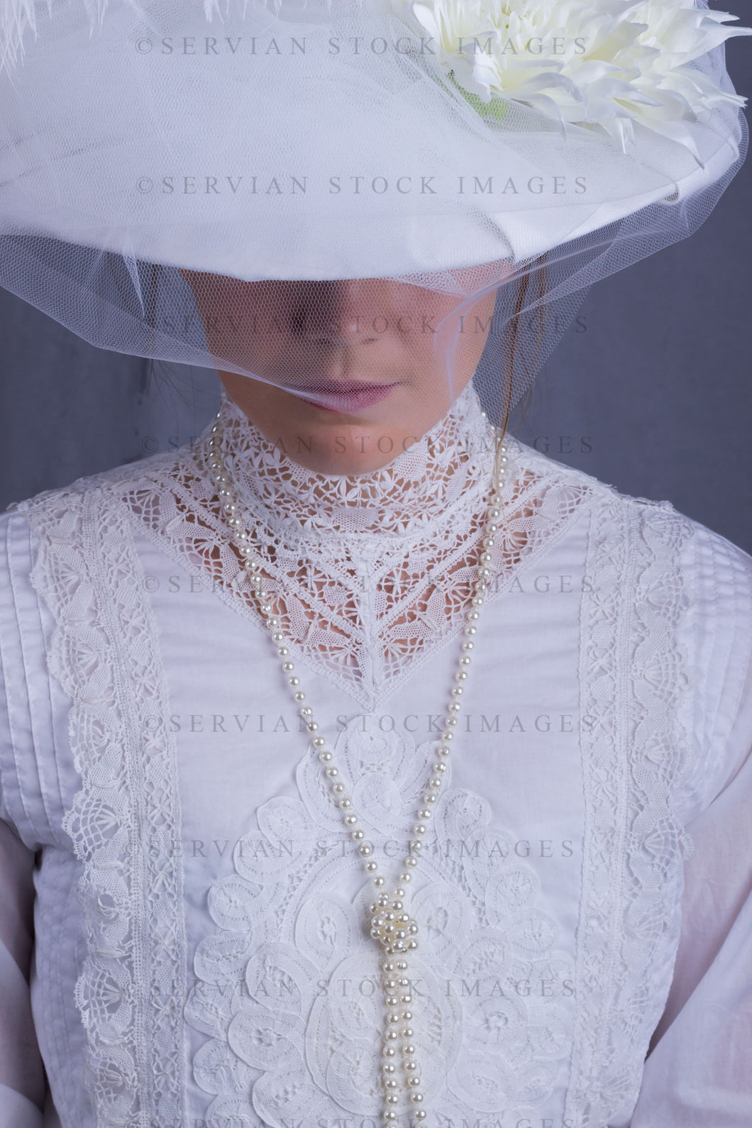 Edwardian woman in a white lace blouse and skirt with a pearl necklace (Tayla 0118)