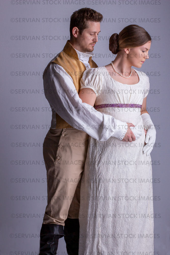 Regency couple against a light grey backdrop (Tayla and Aaron 0248)