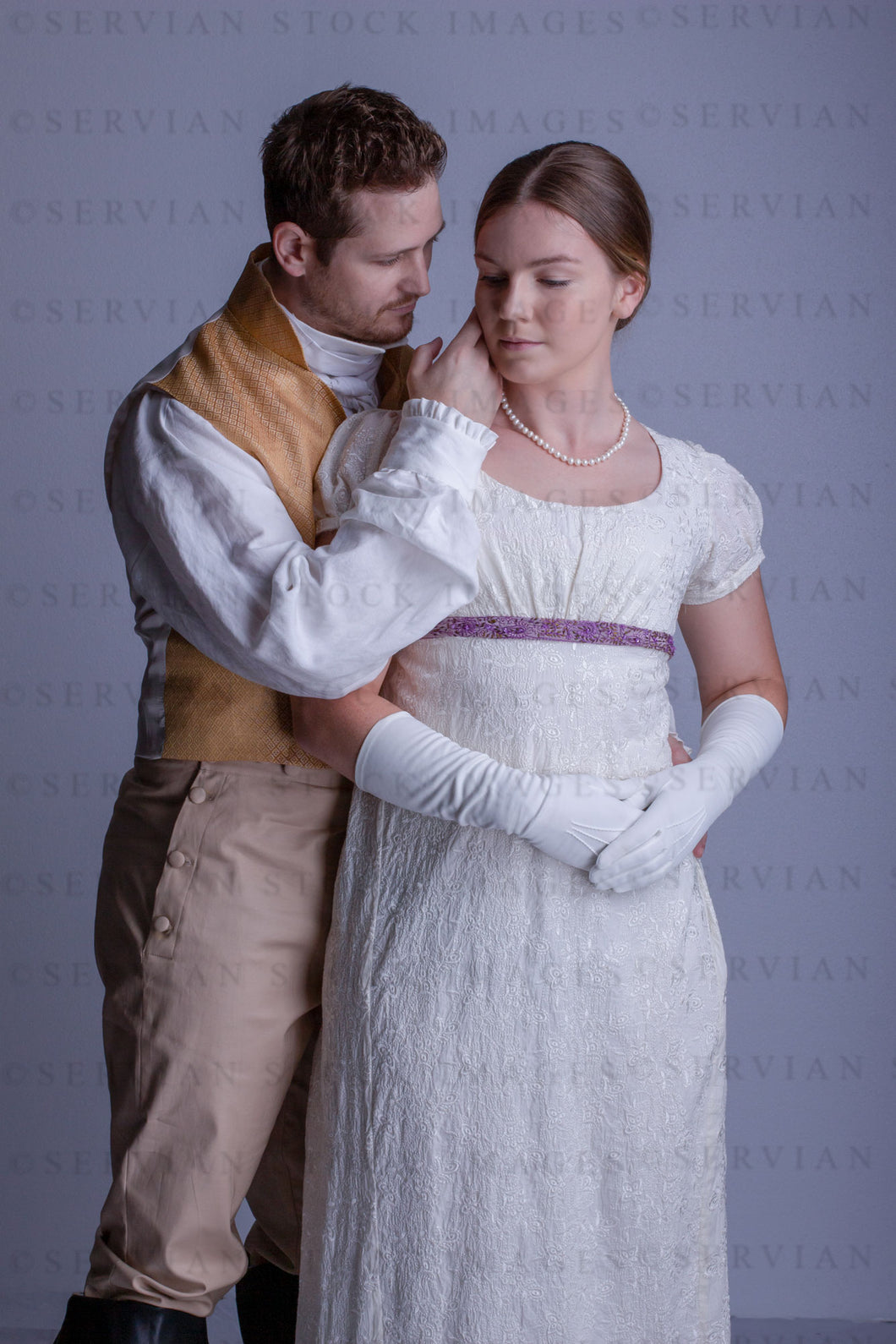 Regency couple against a light grey backdrop (Tayla and Aaron 0253)