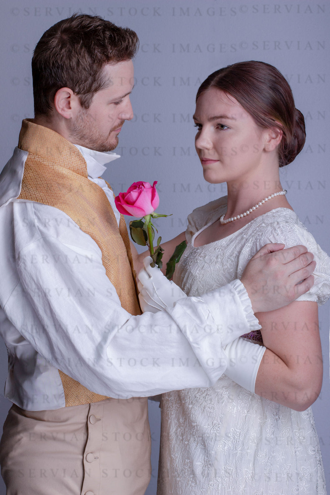 Regency couple against a light grey backdrop (Tayla and Aaron 0273)