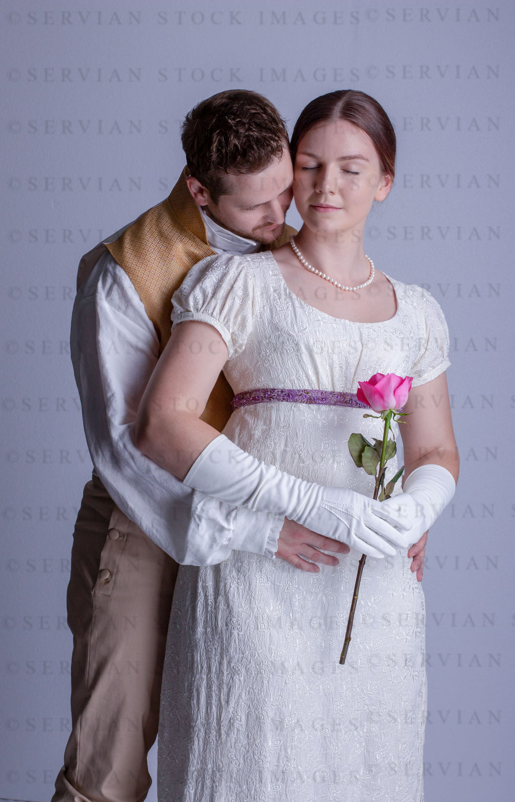 Regency couple against a light grey backdrop (Tayla and Aaron 0290)