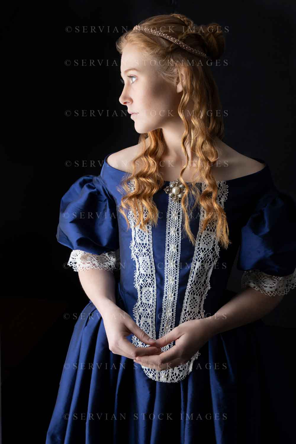 Renaissance woman in a blue silk dress against a black backdrop (Lauren 0497)