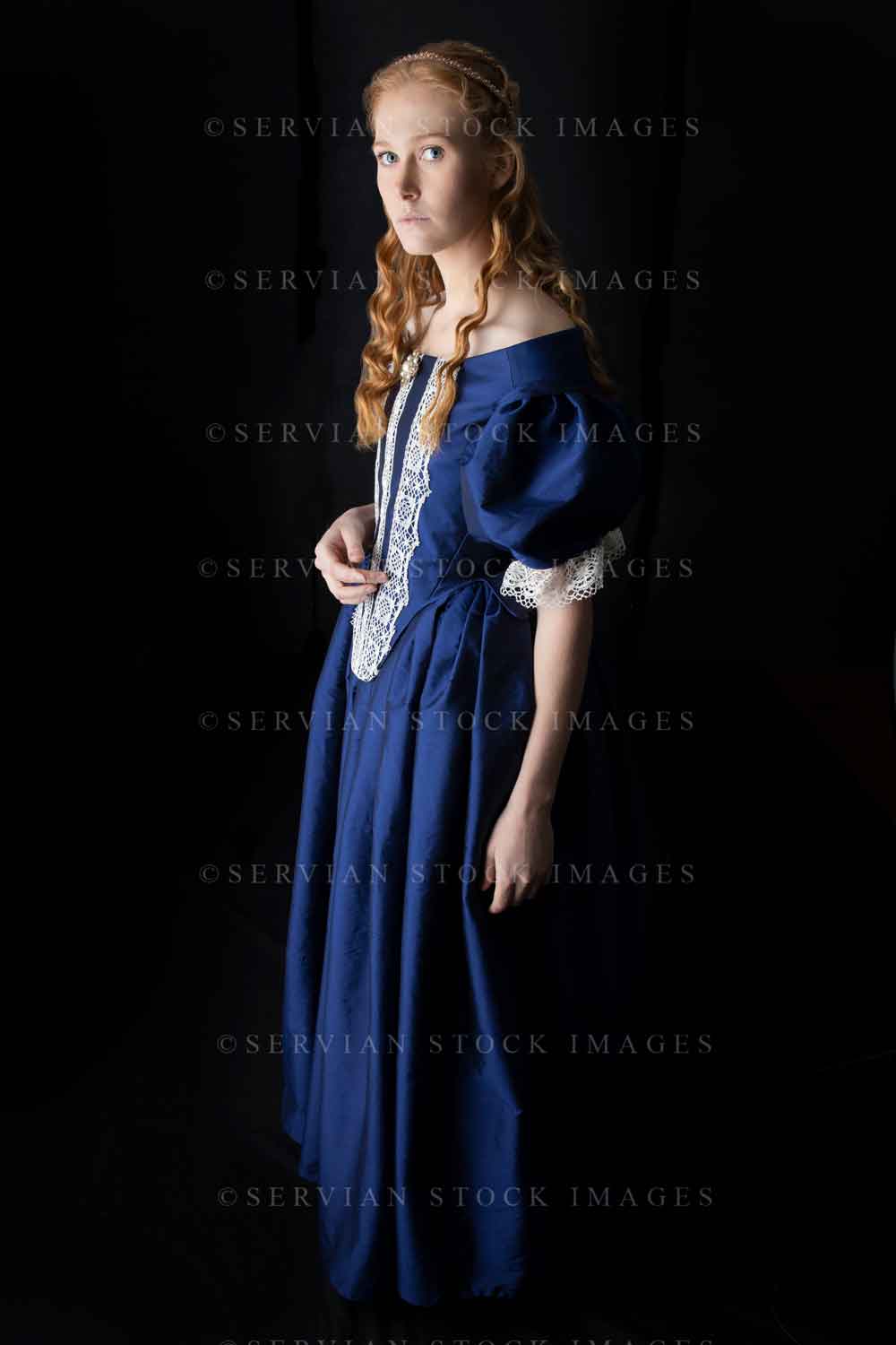 Renaissance woman in a blue silk dress against a black backdrop (Lauren 0513)