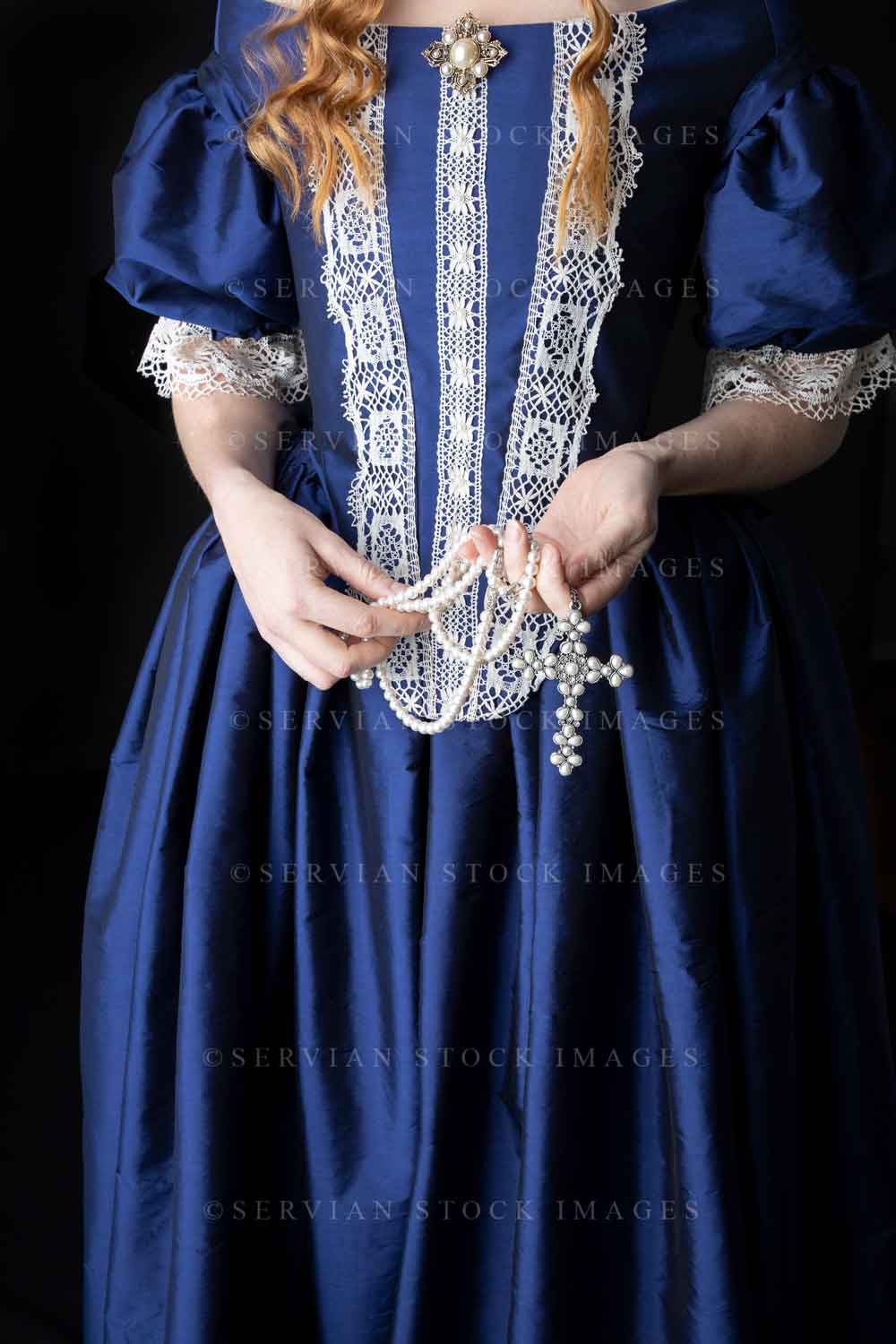 Renaissance woman in a blue silk dress against a black backdrop (Lauren 0537)
