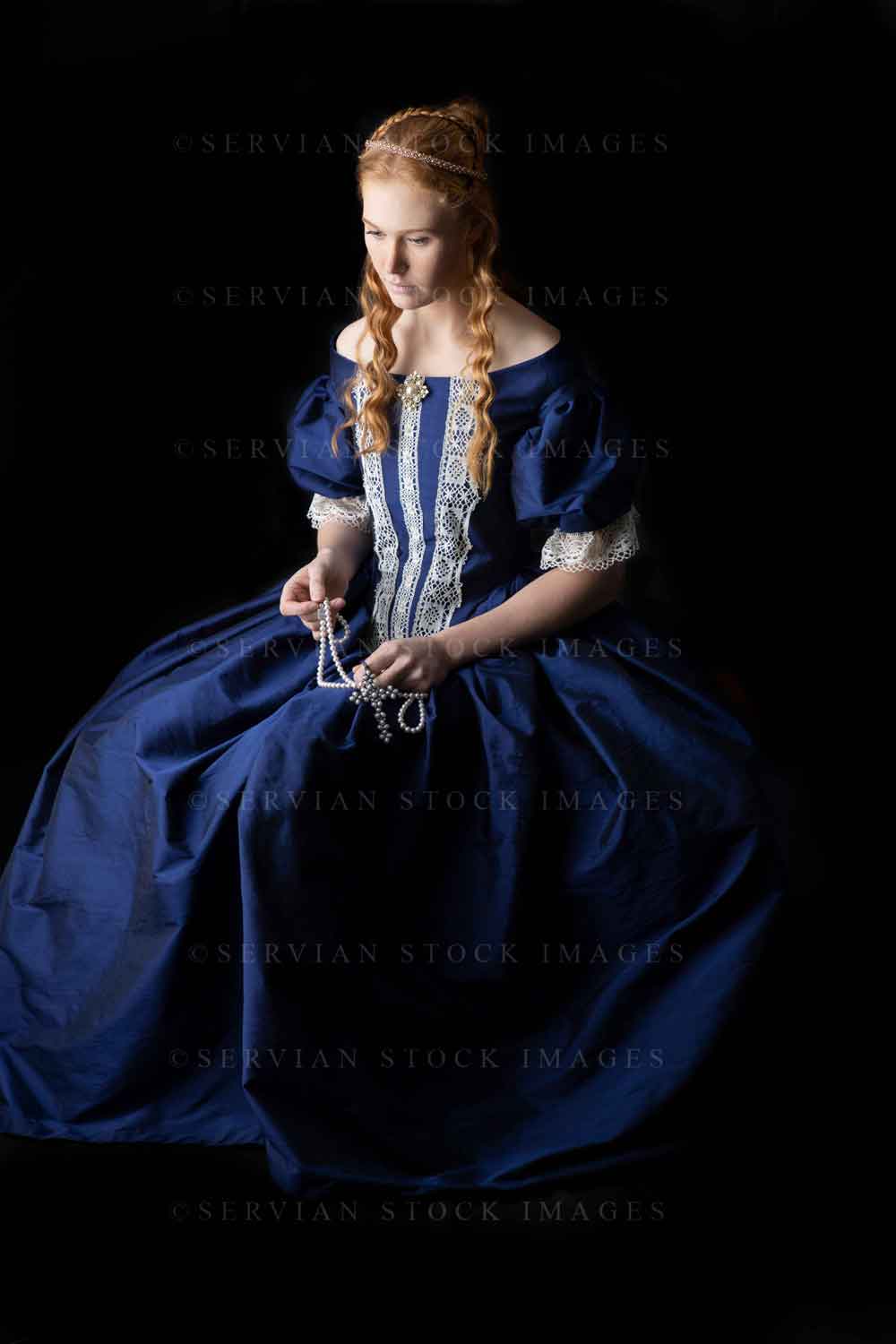 Renaissance woman in a blue silk dress against a black backdrop (Lauren 0623)