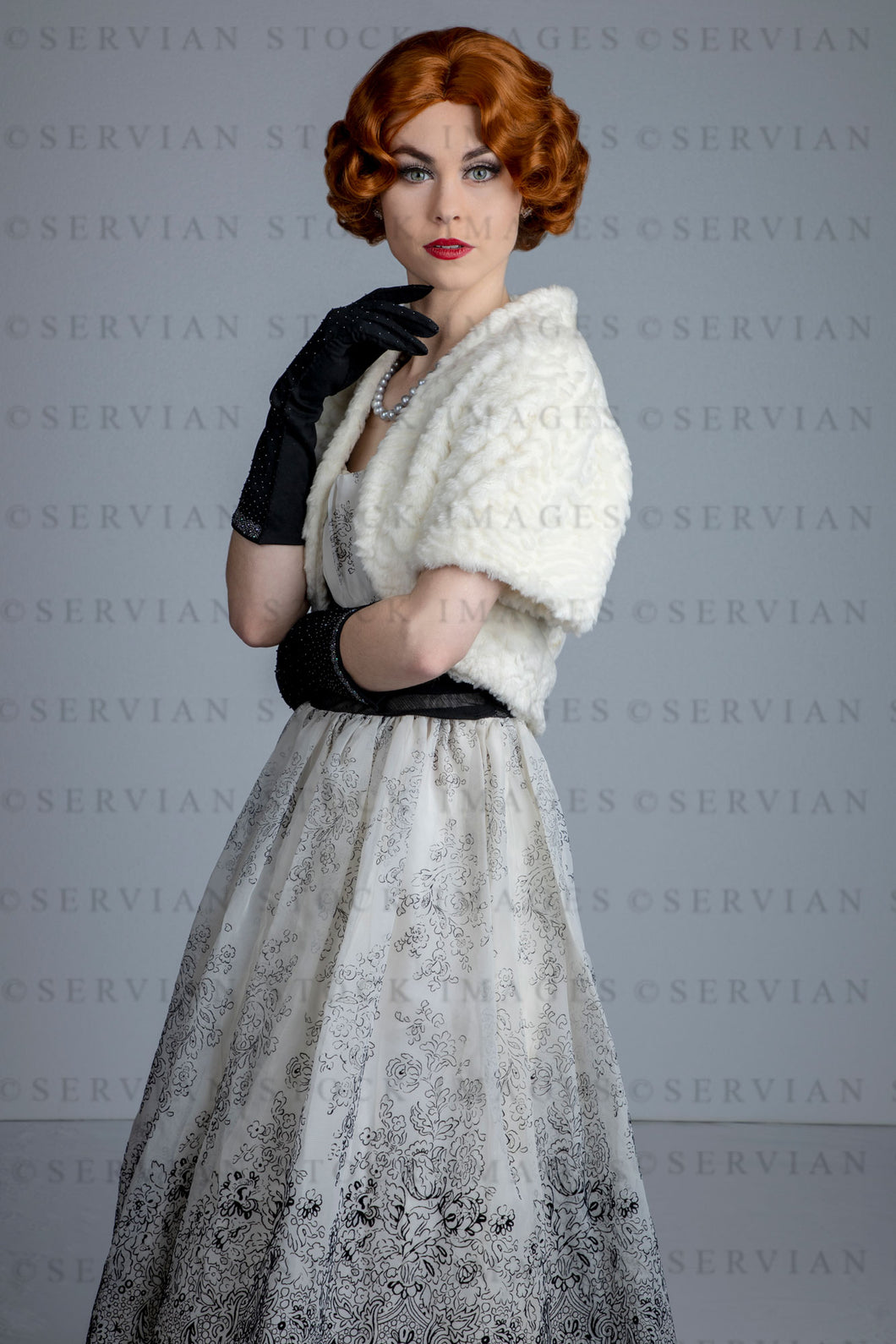 1950s woman in vintage dress, white fur shrug, and black gloves (Lacey 2524)
