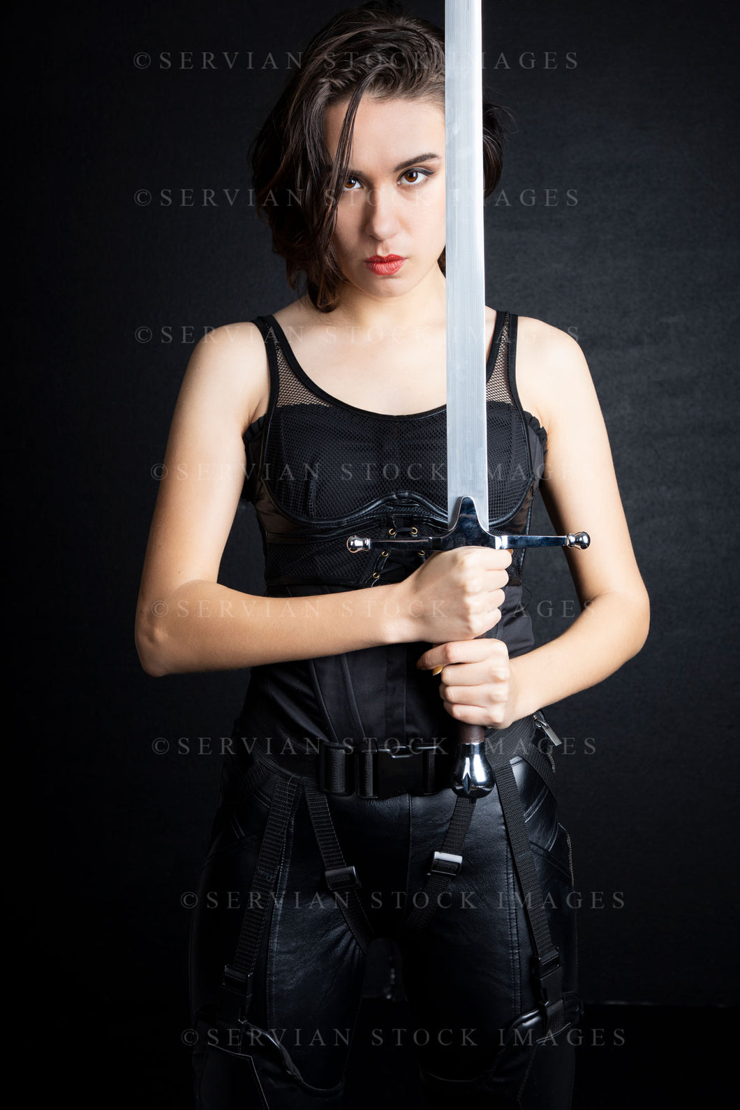 Urban fantasy woman with short dark, hair holding a sword (Sarah 9682)