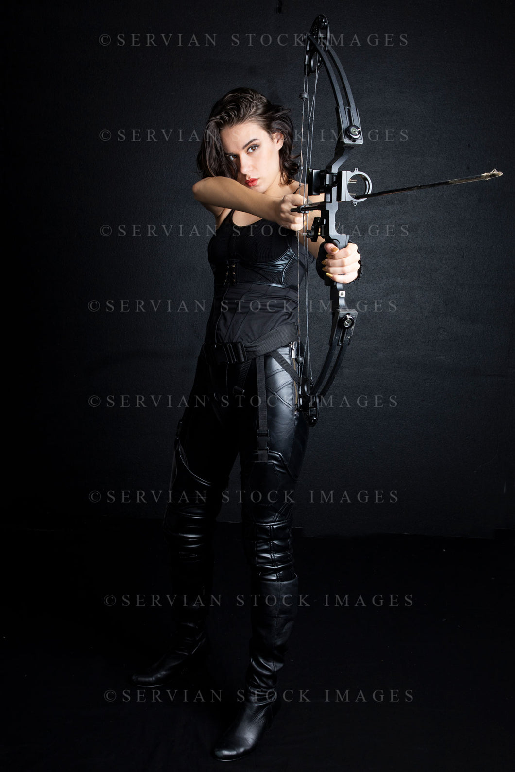 Urban fantasy woman with short dark, hair holding a bow and arrow (Sarah 9694)
