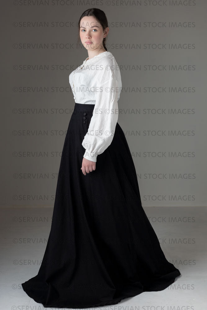 Young Victorian / Edwardian woman wearing a white linen blouse and black skirt (Kate 539)