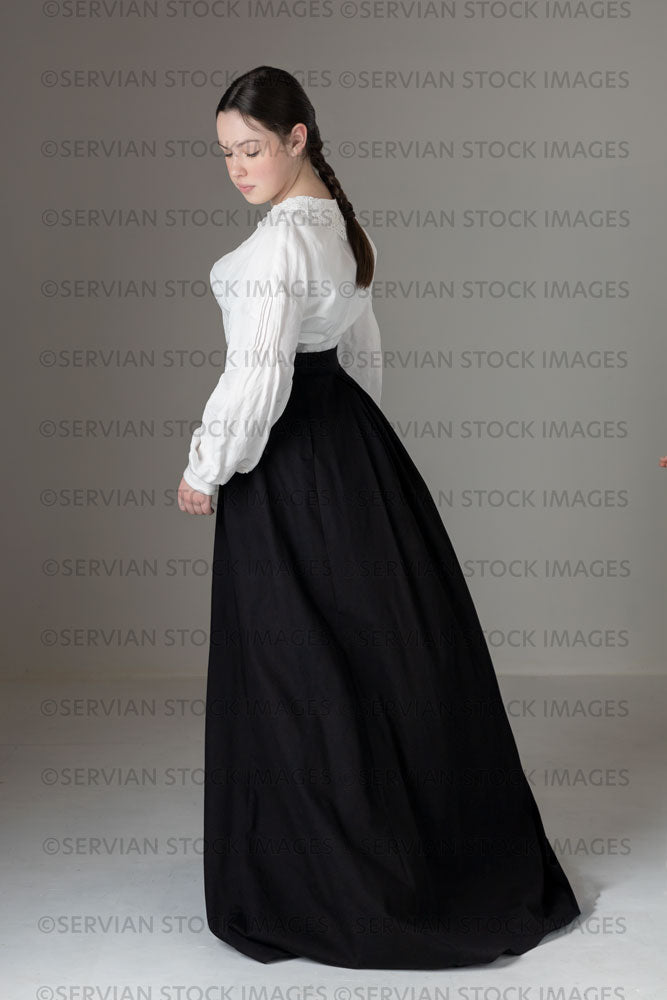 Young Victorian / Edwardian woman wearing a white linen blouse and black skirt (Kate 564)