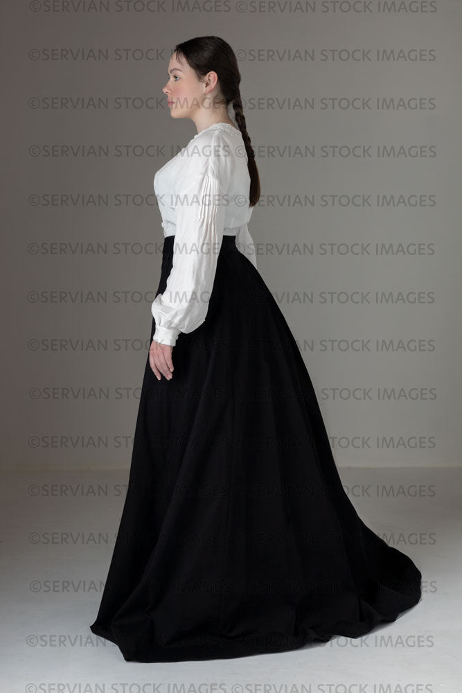 Young Victorian / Edwardian woman wearing a white linen blouse and black skirt (Kate 568)