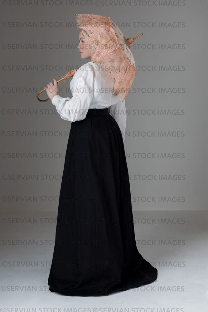 Young Victorian / Edwardian woman wearing a white linen blouse and black skirt (Kate 571)