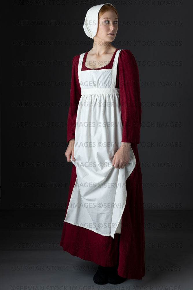 Regency maid or working class woman wearing a red dress, apron, and cap (Lauren 0622)