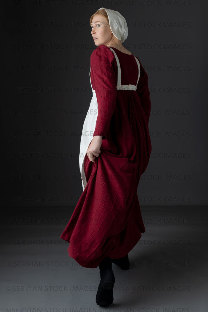 Regency maid or working class woman wearing a red dress, apron, and cap (Lauren 06511)