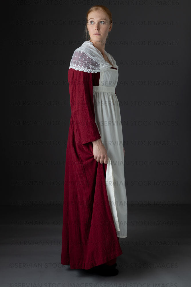 Regency maid or working class woman wearing a red dress, apron, and shawl(Lauren 06641)