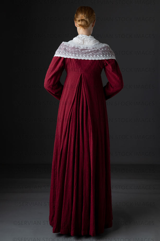Regency woman wearing a red dress with a lace modesty shawl (Lauren 0692)