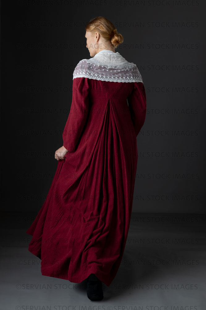 Regency woman wearing a red dress with a lace modesty shawl (Lauren 0696)