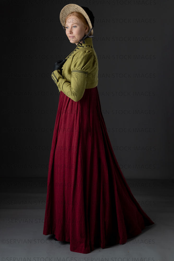 Regency woman wearing a red dress with a green linen spencer and bonnet  (Lauren 0745)