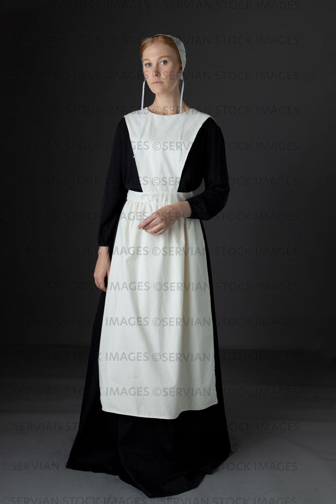 Amish woman wearing a black dress with a white apron and cap (Lauren 0780)