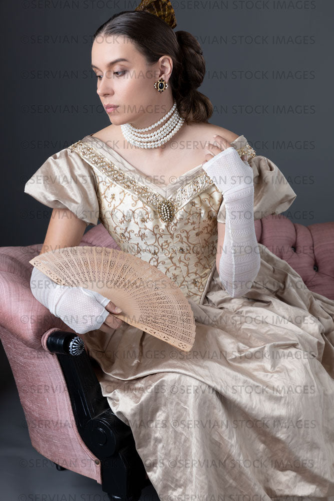 Victorian woman wearing a gold ball gown  (Sarah 1769)