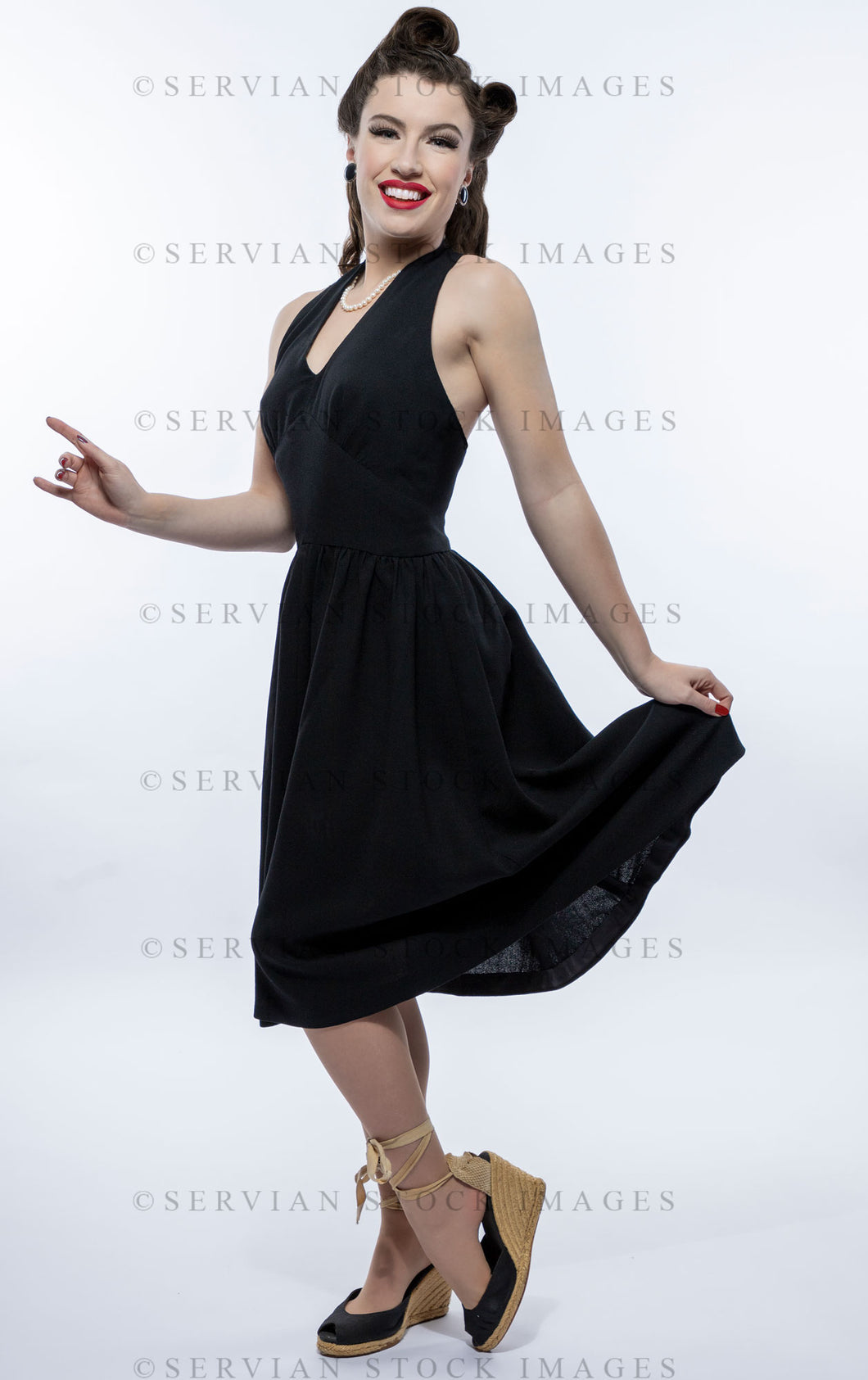 1940s woman in a black halter neck dress (Victoria 1850) Servian Stock Images 1940s woman in a black halter neck dress (Victoria 1850) Servian Stock Images