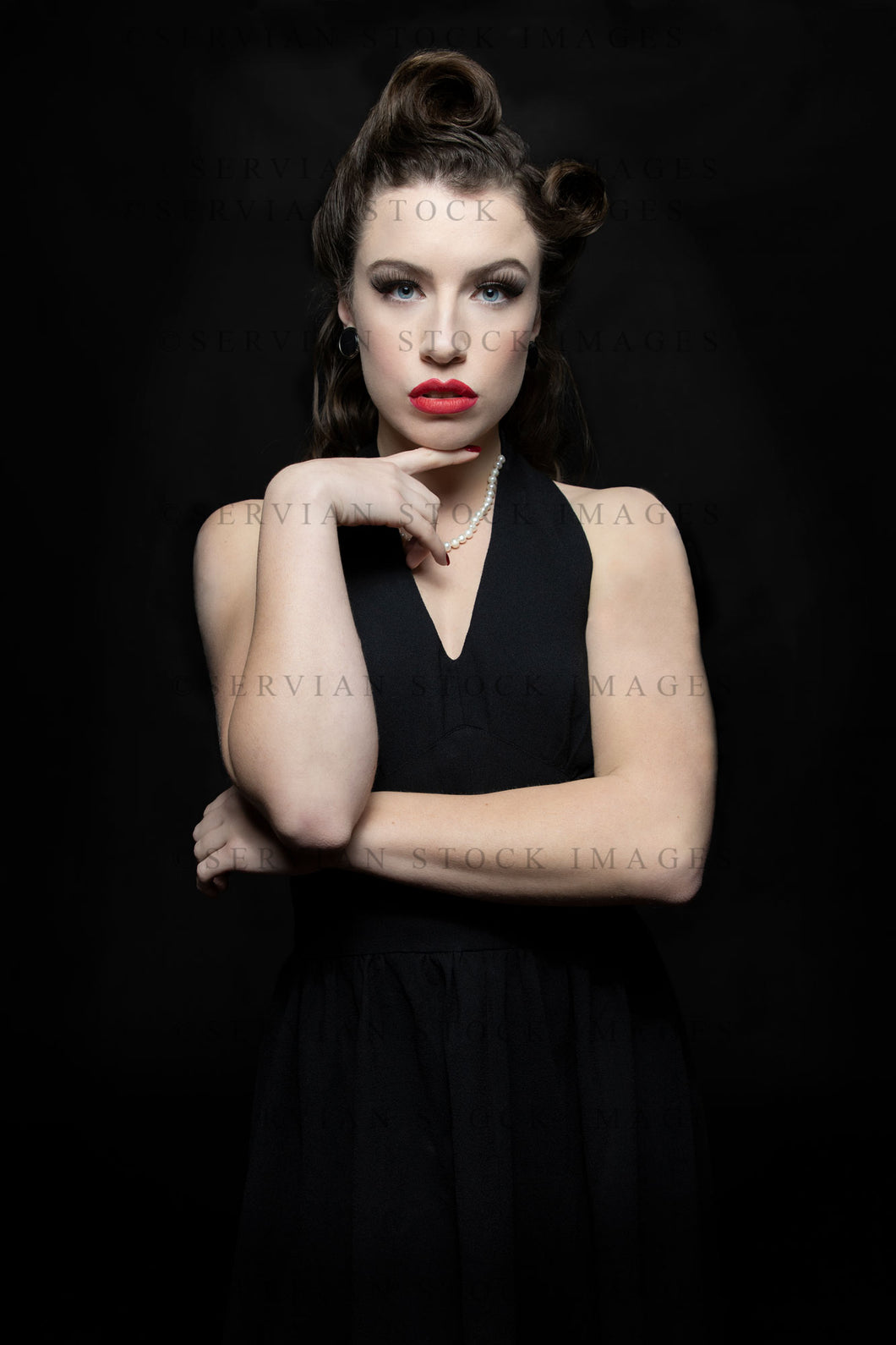 1940s woman in a black halter neck dress (Victoria 1873) Servian Stock Images 1940s woman in a black halter neck dress (Victoria 1873) Servian Stock Images