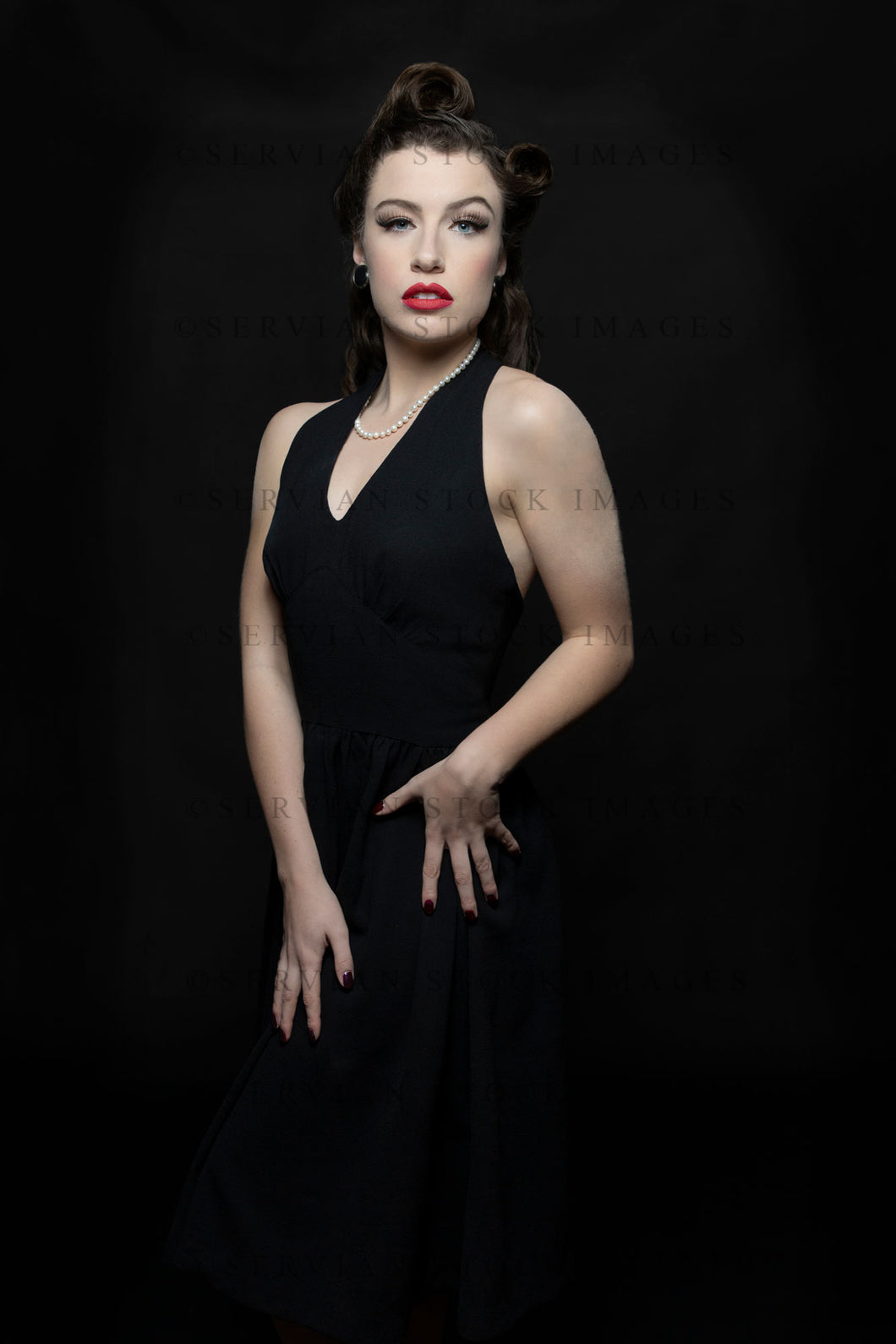 1940s woman in a black halter neck dress (Victoria 1882) Servian Stock Images 1940s woman in a black halter neck dress (Victoria 1882) Servian Stock Images