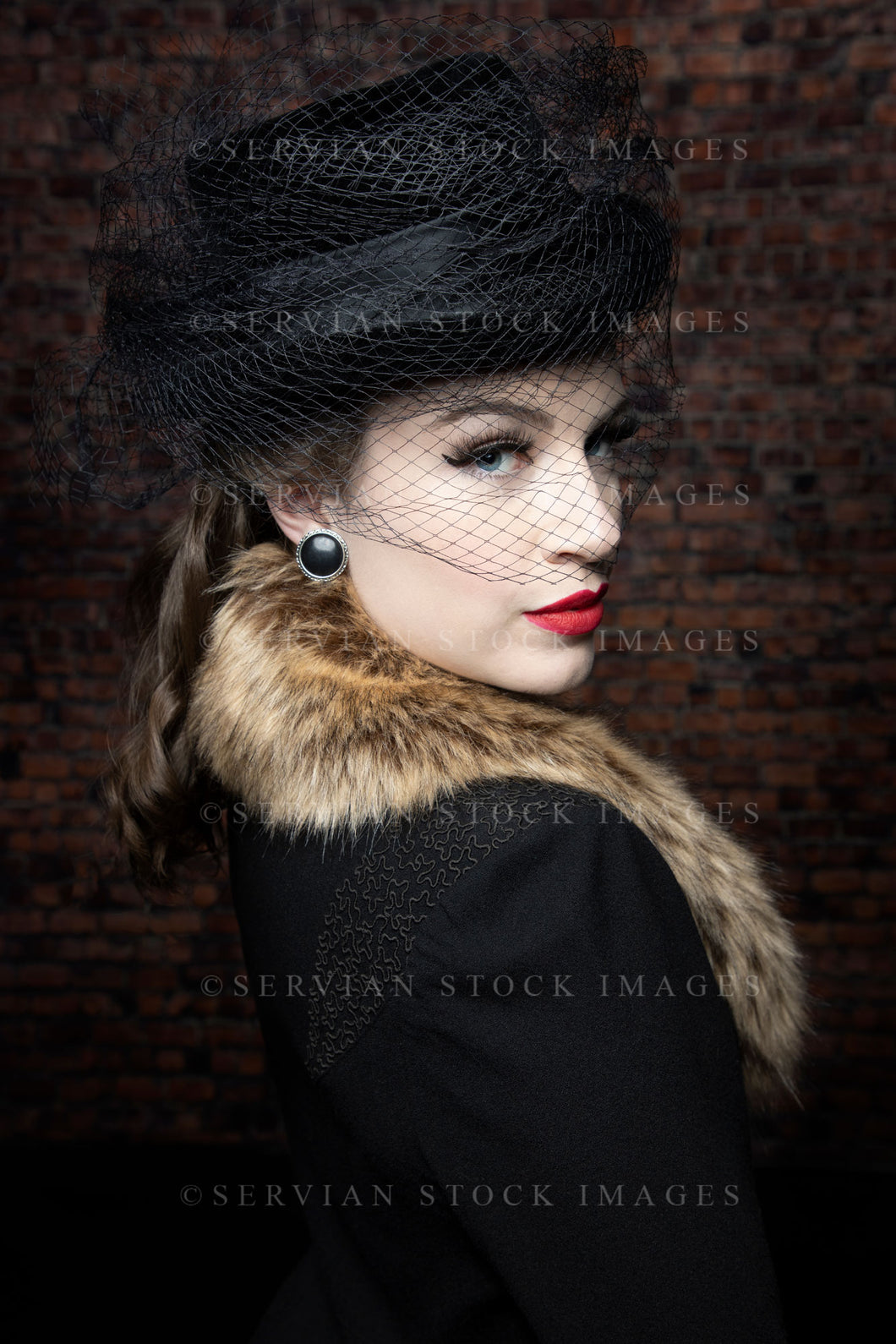 1940s woman in a black coat dress and fur collar (Victoria 2039)