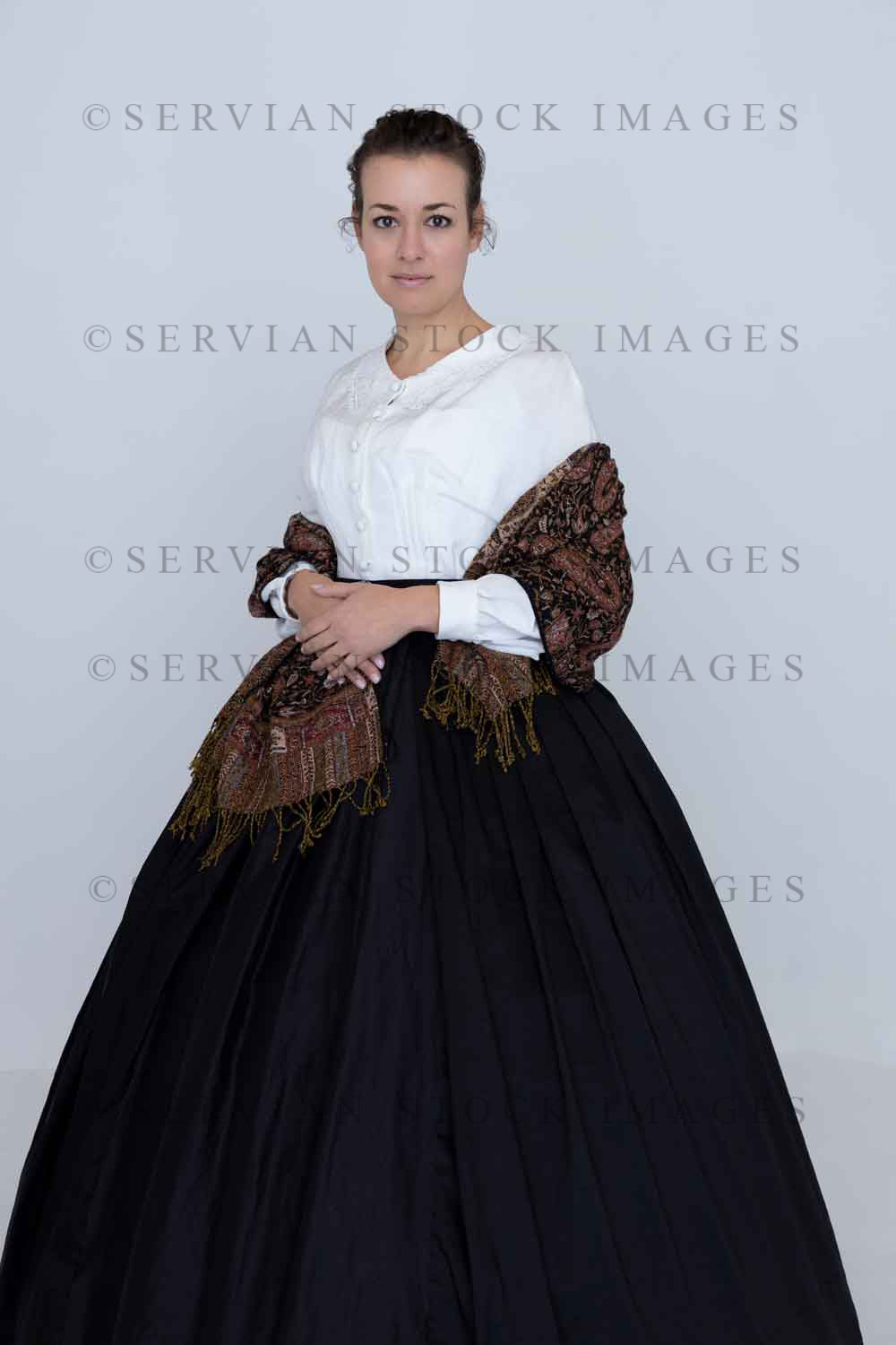 Victorian woman wearing a Garibaldi blouse, paisley shawl, and full skirt against a white backdrop (Emma 2343)