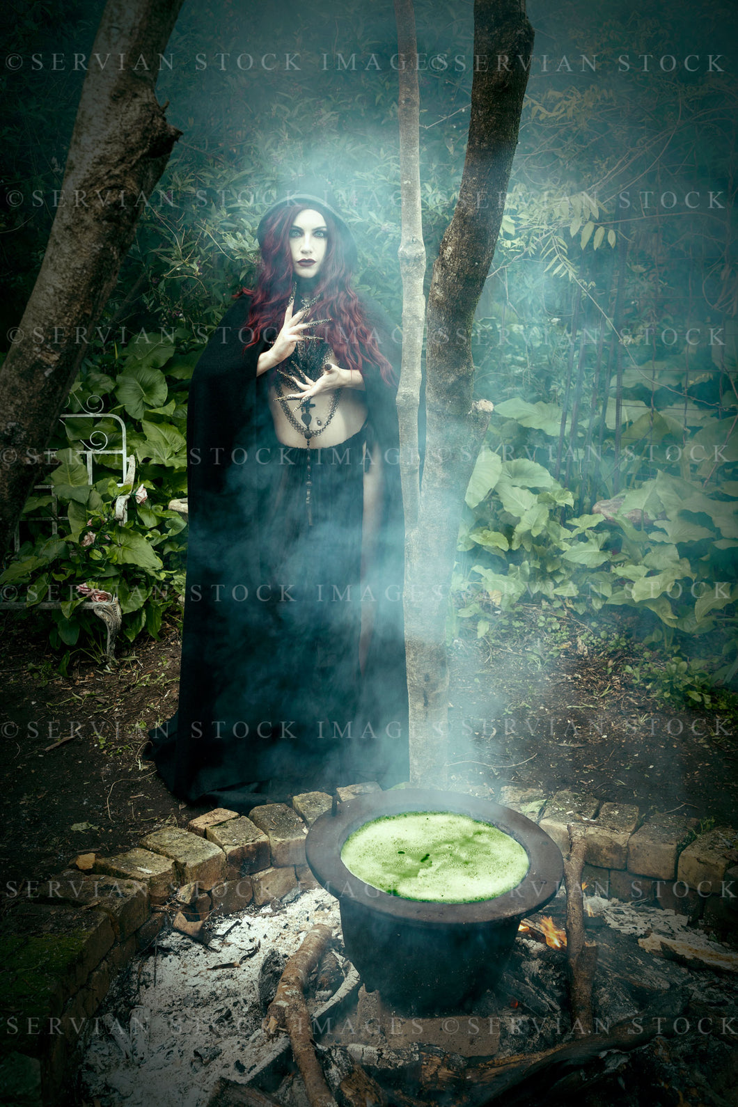 High Fantasy witch beside a bubbling cauldron (Victoria 2688)