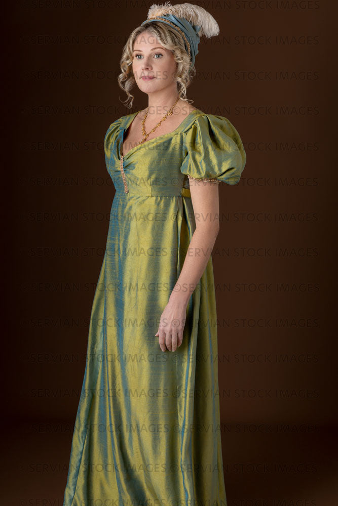 Regency woman wearing a green shot silk dress and turban (Sherilyn 2700)