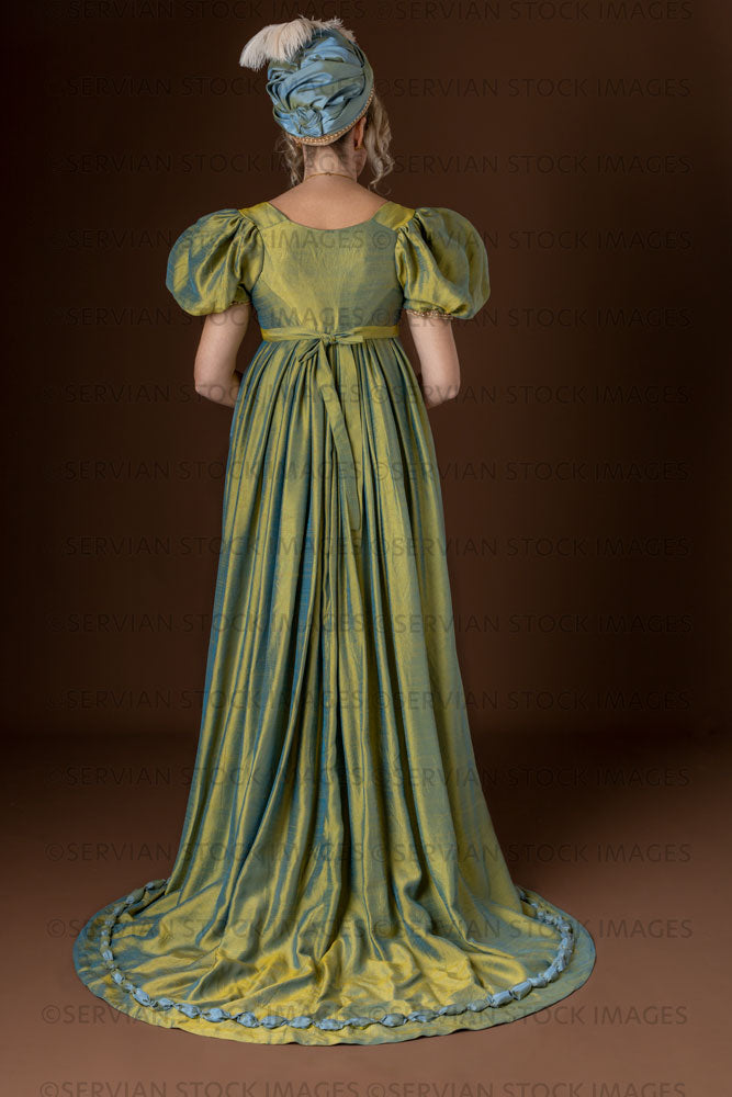 Regency woman wearing a green shot silk dress and turban (Sherilyn 2706)